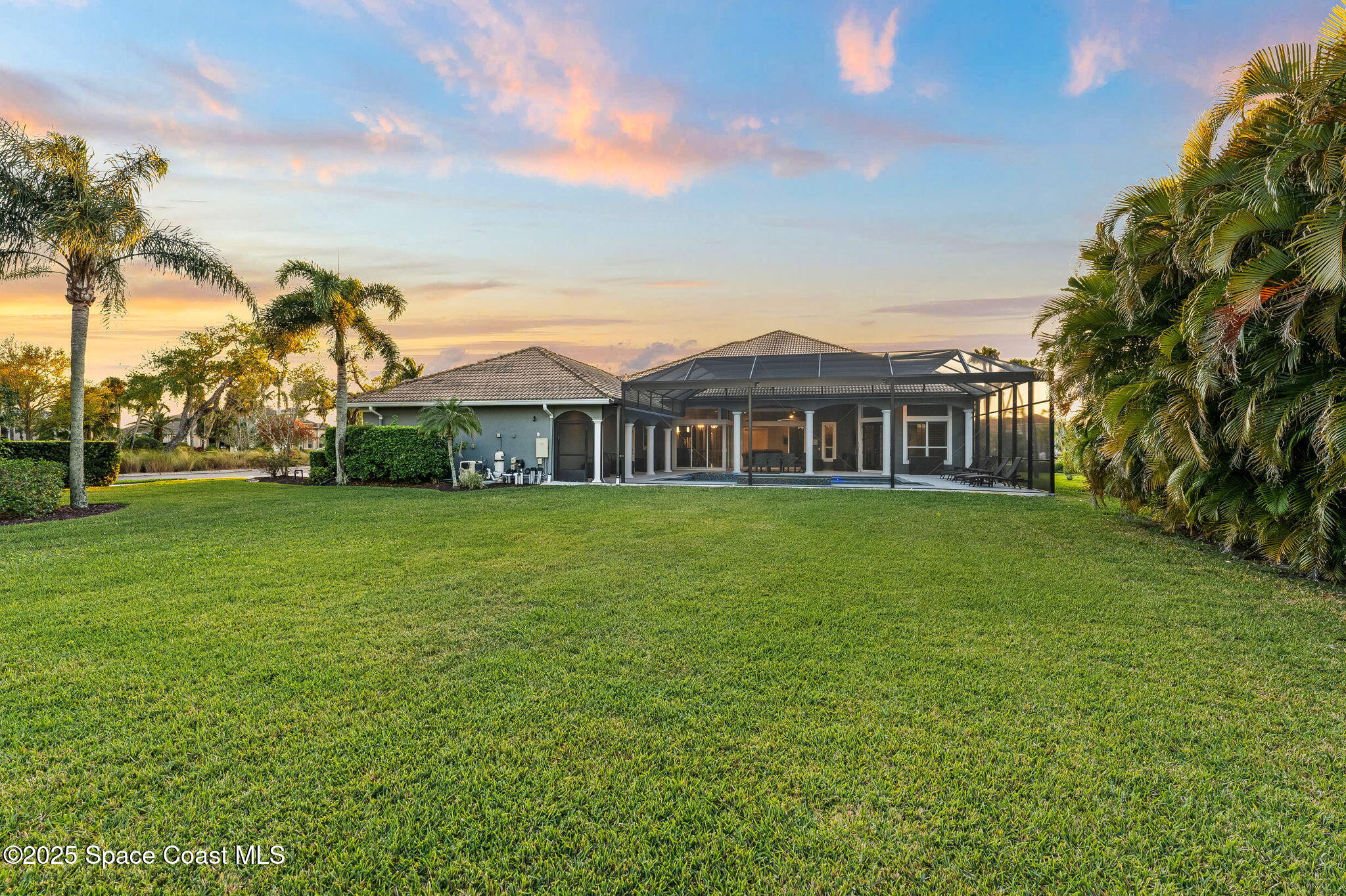3152 BELLWIND Circle Rockledge, FL 32955 - Photo 40 of 47 a front view of a house with a garden