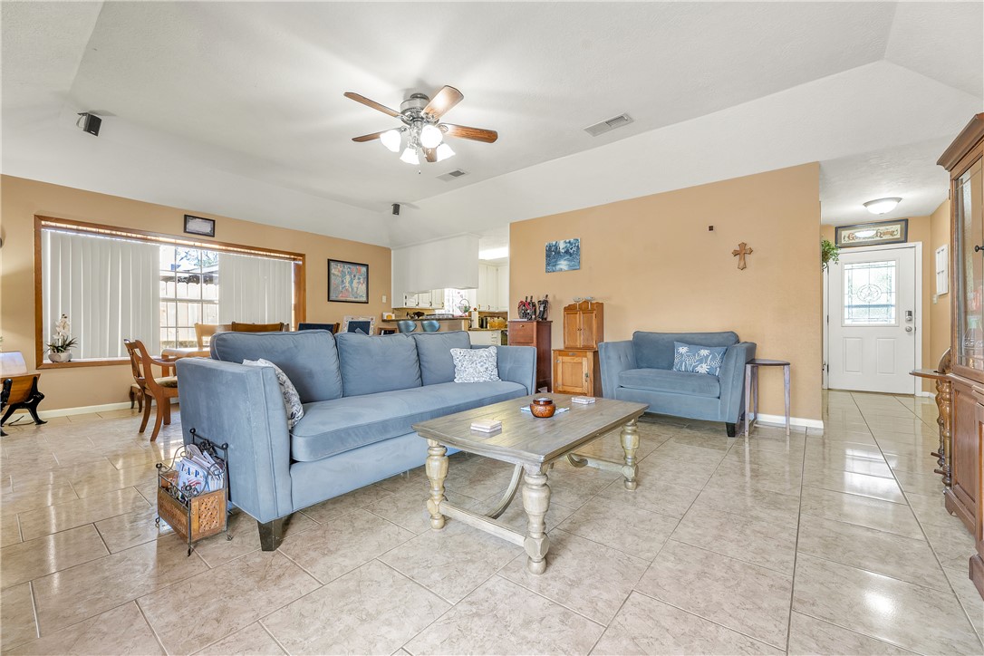3319 Big Bend Drive Bryan, TX 77803 - Photo 11 of 19 a living room with furniture and a chandelier