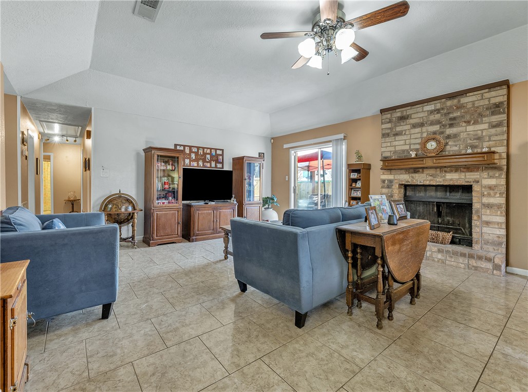 3319 Big Bend Drive Bryan, TX 77803 - Photo 13 of 19 a living room with furniture and a fireplace