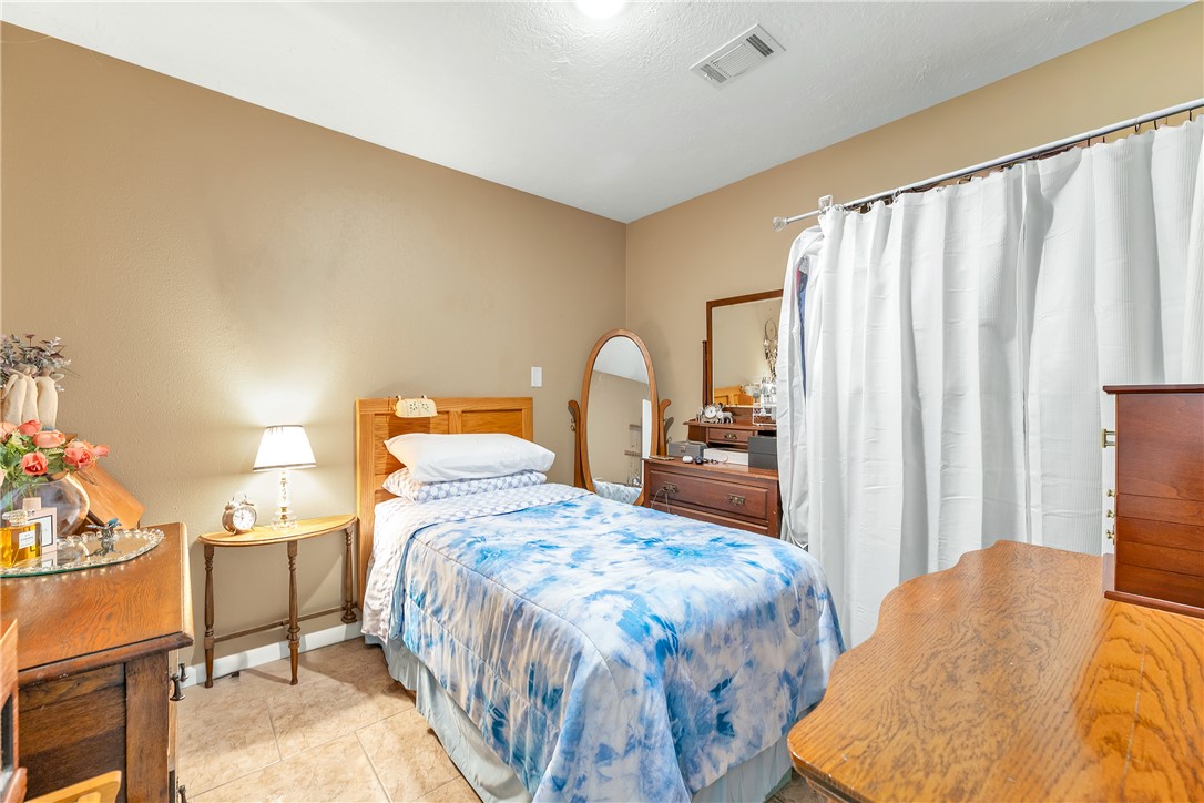 3319 Big Bend Drive Bryan, TX 77803 - Photo 19 of 19 a bedroom with a bed and wooden floor