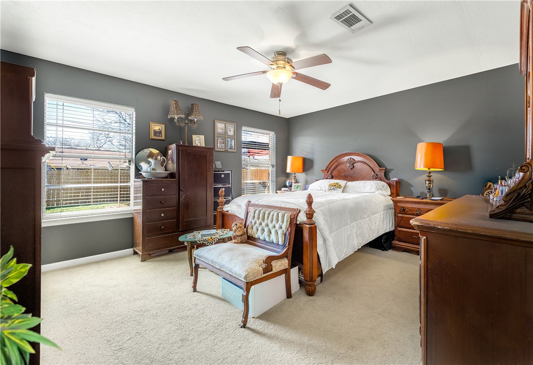 3319 Big Bend Drive Bryan, TX 77803 - Photo 4 of 19 a spacious bedroom with a bed and a chandelier