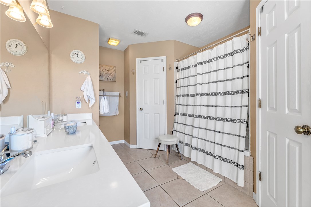 3319 Big Bend Drive Bryan, TX 77803 - Photo 5 of 19 a bathroom with a bathtub and a shower