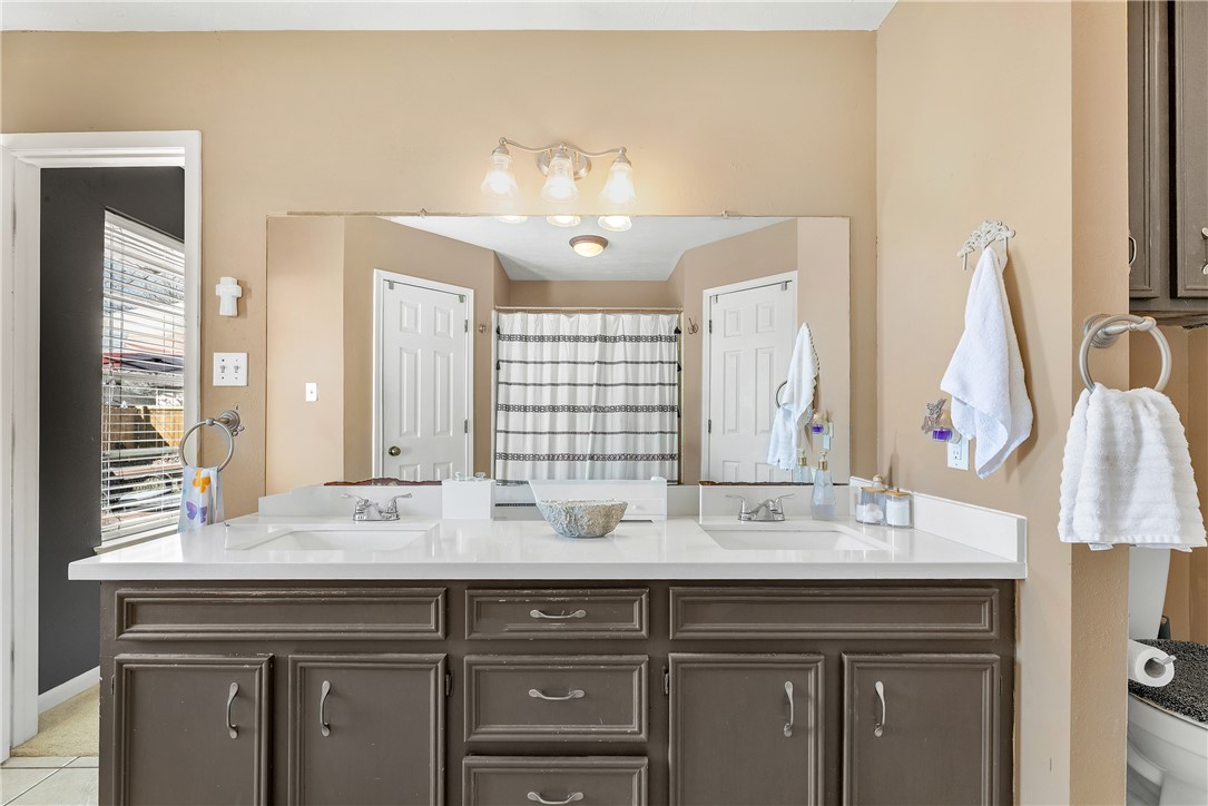 3319 Big Bend Drive Bryan, TX 77803 - Photo 6 of 19 a bathroom with a sink and a mirror