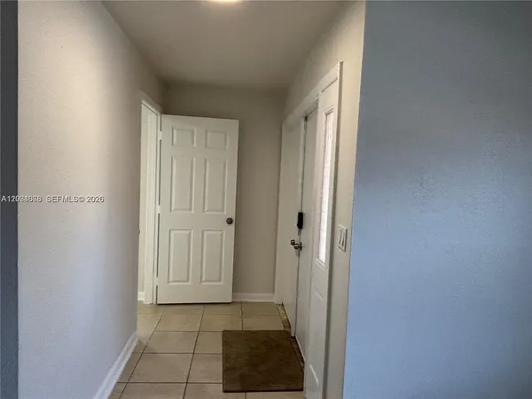 a view of a closet area with living room