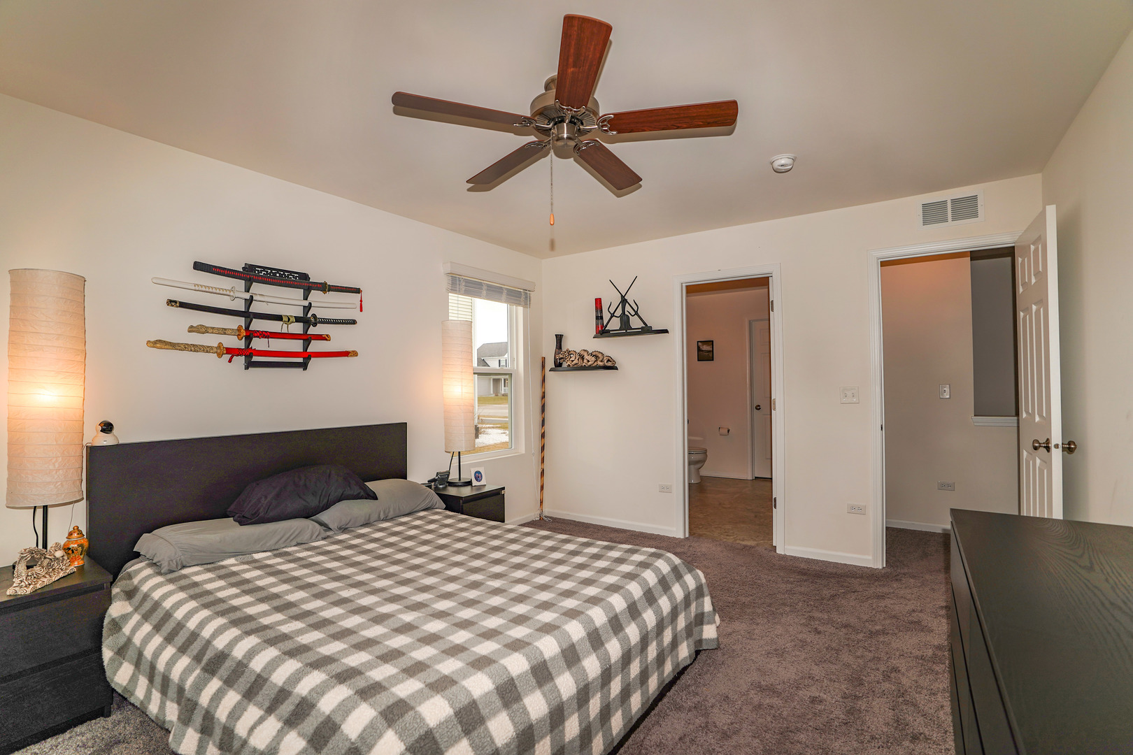 6611 Eich Drive Joliet, IL 60431 - Photo 11 of 21 a bedroom with a bed and a chandelier