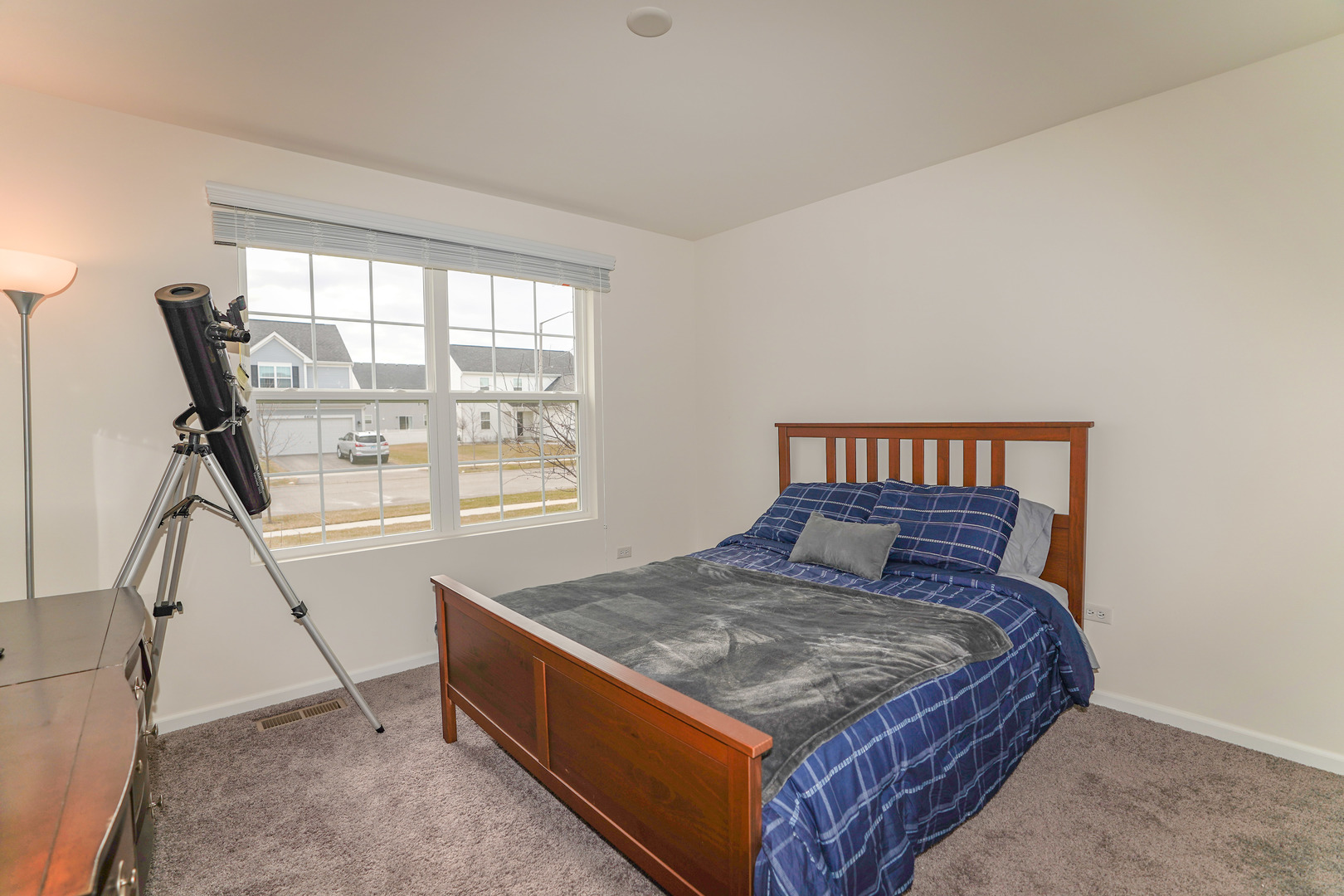 6611 Eich Drive Joliet, IL 60431 - Photo 12 of 21 a bed sitting in a bedroom next to a window