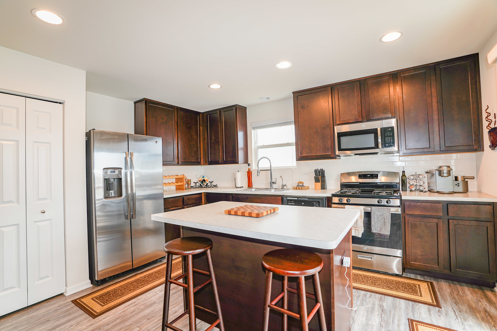6611 Eich Drive Joliet, IL 60431 - Photo 5 of 21 a kitchen with stainless steel appliances granite countertop a refrigerator stove microwave and sink