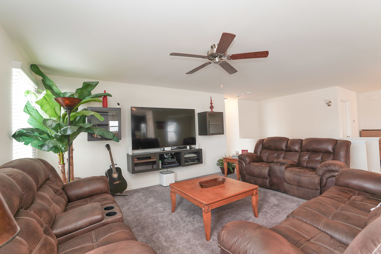 6611 Eich Drive Joliet, IL 60431 - Photo 6 of 21 a living room with furniture and a flat screen tv