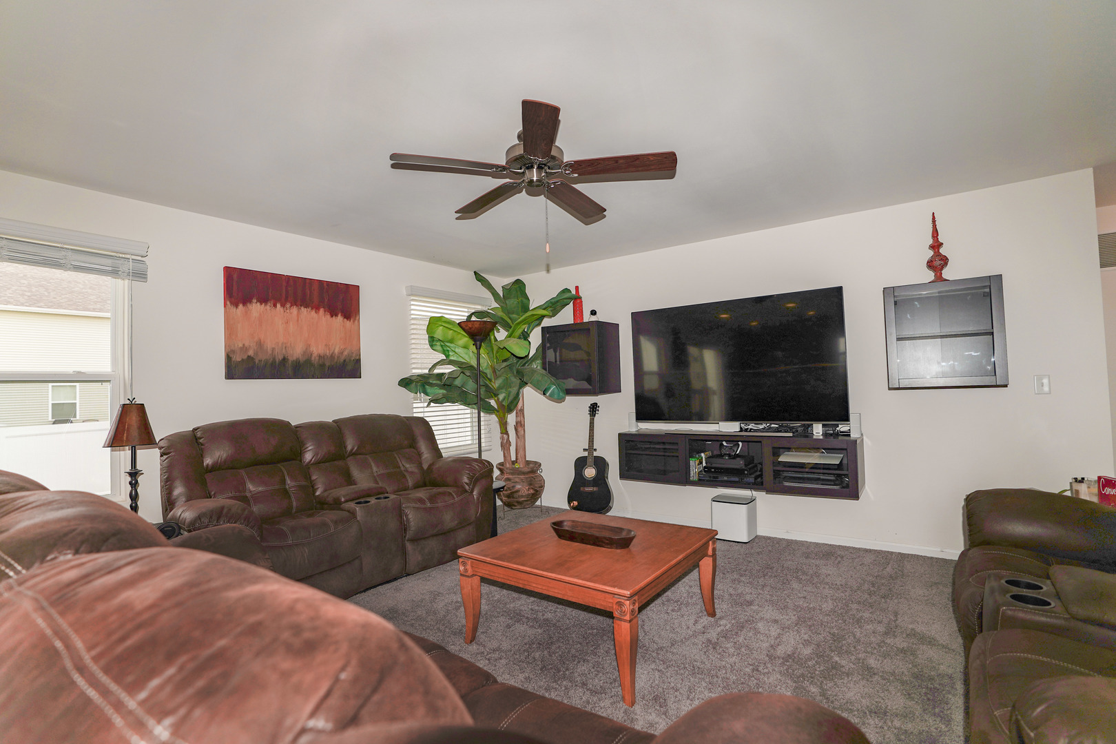 6611 Eich Drive Joliet, IL 60431 - Photo 7 of 21 a living room with furniture and a flat screen tv