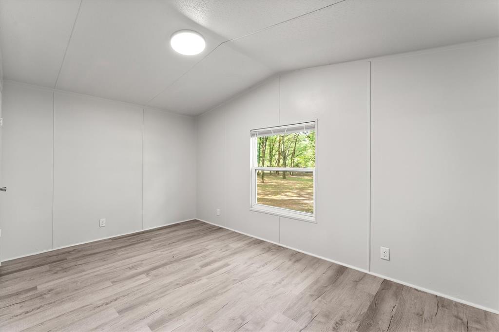 367 Box Road Gun Barrel City, TX 75156 - Photo 20 of 25 an empty room with a window