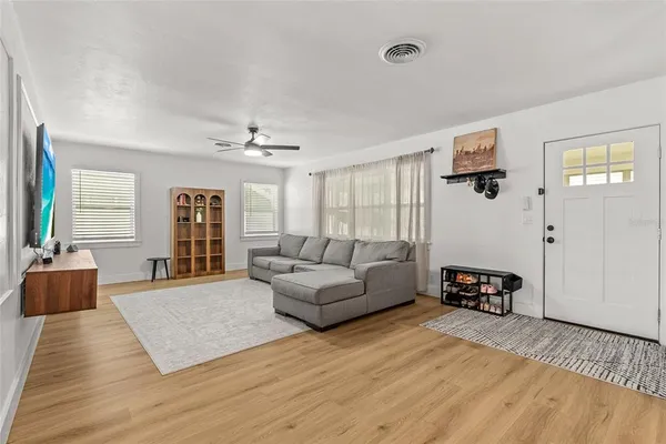 a view of a livingroom with furniture and windows