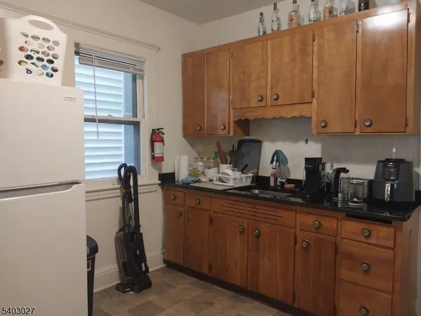 a kitchen with appliances and cabinets