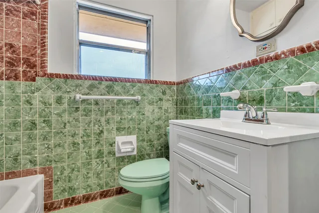 a bathroom with a bathtub and shower