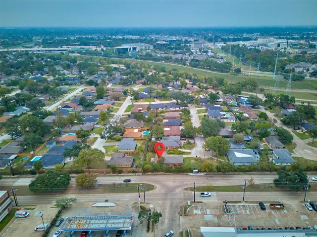 an aerial view of residential houses with outdoor space
