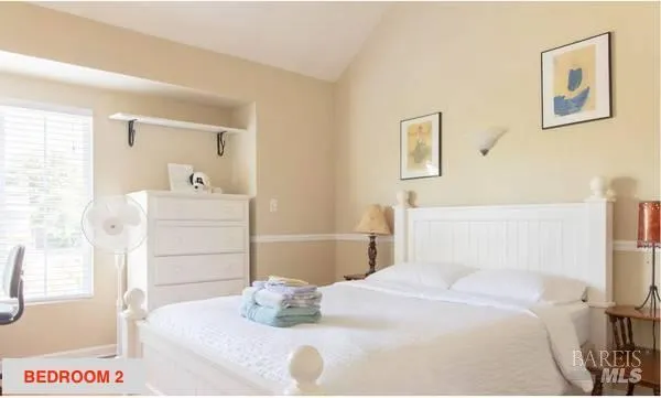 a bedroom with a bed and a cabinets