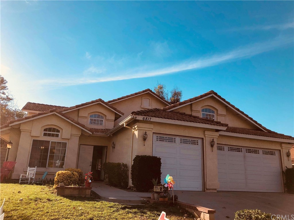 6817 Mission Grove Riverside, CA 92506 - Photo 1 of 1 a front view of a house with garden