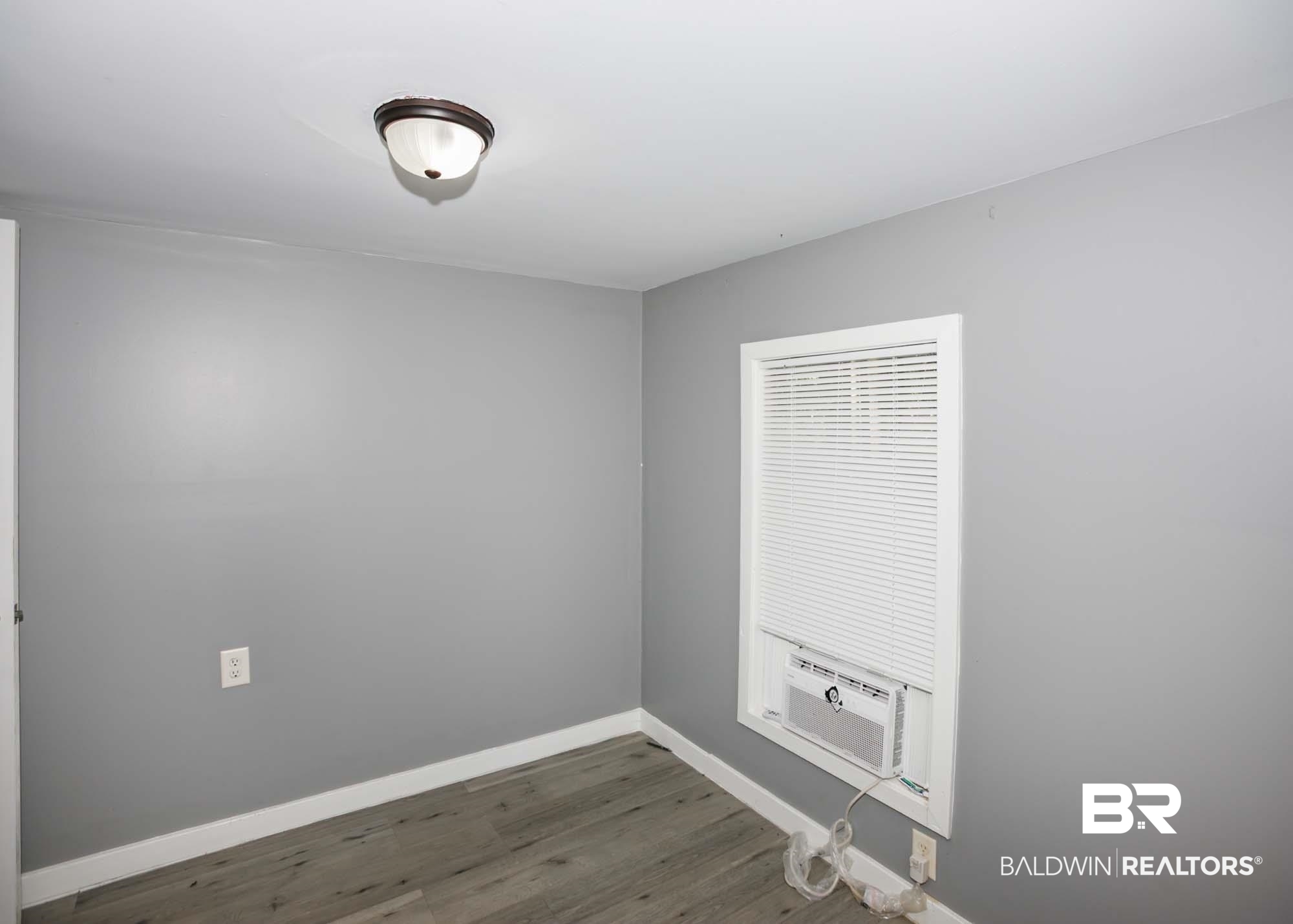 11998 Workman Avenue Foley, AL 36535 - Photo 59 of 59 Unfurnished room with dark wood finished floors and cooling unit