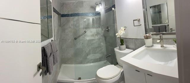 271 Durham, Unit 271 Deerfield Beach, FL 33442 - Photo 23 of 34 a white toilet sitting next to a bathroom sink