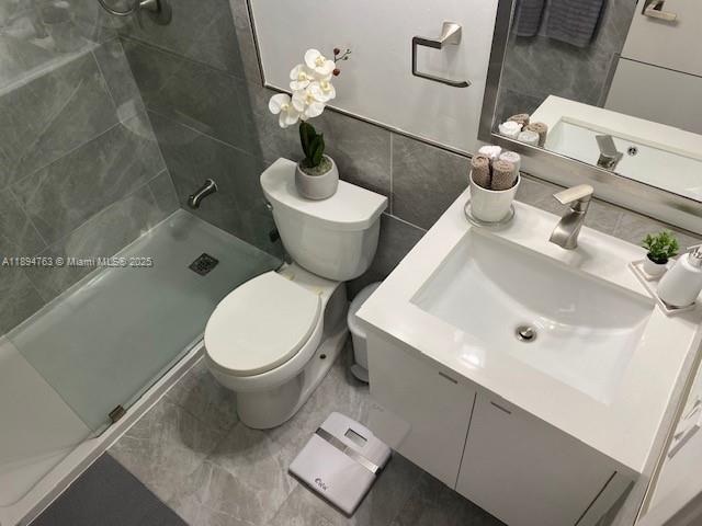271 Durham, Unit 271 Deerfield Beach, FL 33442 - Photo 25 of 34 a white toilet sitting next to a bathroom sink