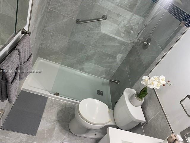 271 Durham, Unit 271 Deerfield Beach, FL 33442 - Photo 26 of 34 a white toilet sitting next to a bath tub