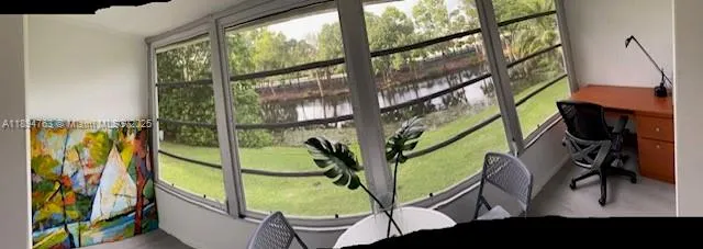 a dining room with furniture window and outside view