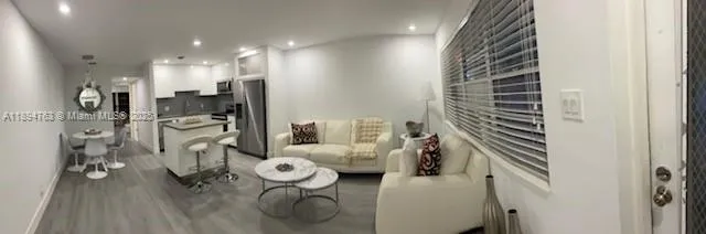 a bedroom with furniture and a chandelier