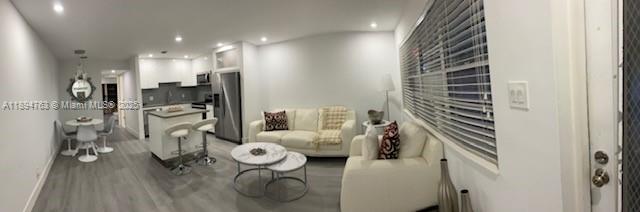 271 Durham, Unit 271 Deerfield Beach, FL 33442 - Photo 5 of 34 a bedroom with furniture and a chandelier