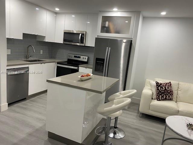 271 Durham, Unit 271 Deerfield Beach, FL 33442 - Photo 6 of 34 a kitchen with stainless steel appliances granite countertop a sink refrigerator and microwave