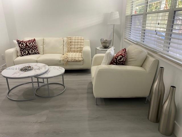 271 Durham, Unit 271 Deerfield Beach, FL 33442 - Photo 10 of 34 a living room with furniture and a window