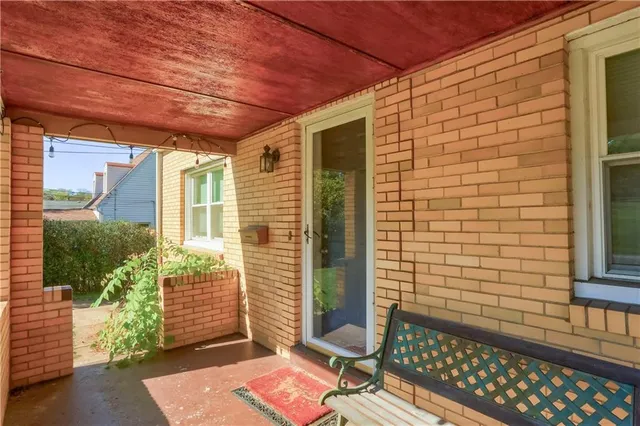 a view of a door and wooden floor