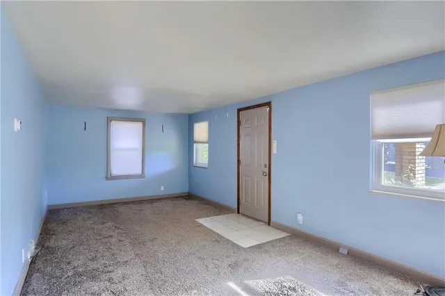 an empty room with windows