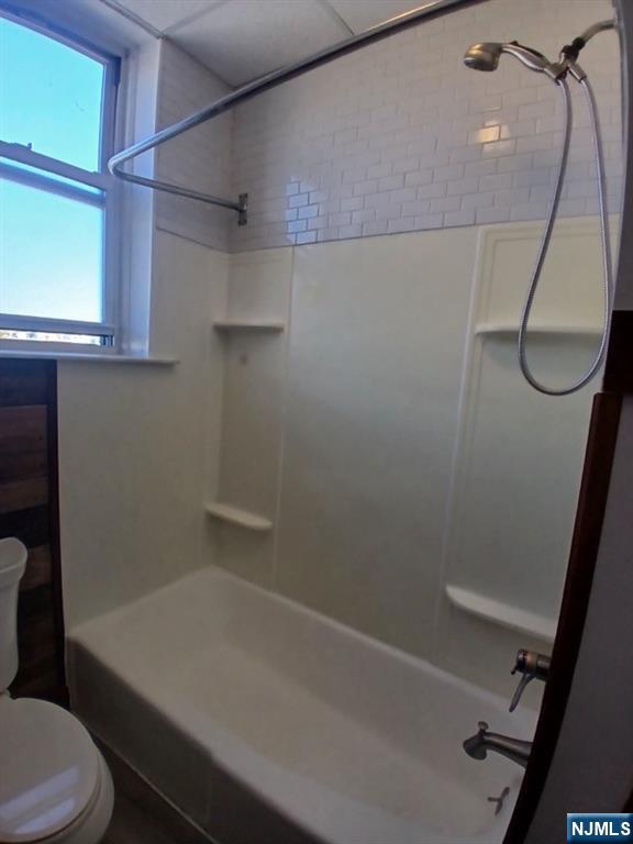 70 Main Street, Unit 3 Little Falls, NJ 07424 - Photo 7 of 10 a bathroom with a shower and toilet
