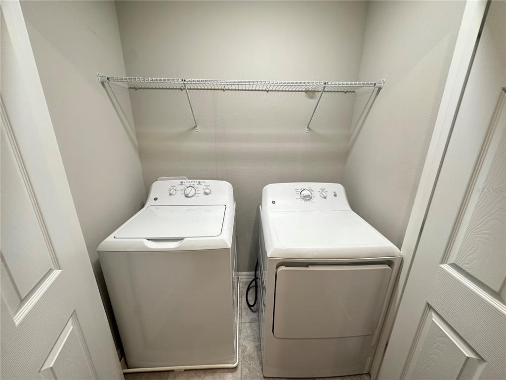 10834 Wyne Tree Orlando, FL 32824 - Photo 12 of 33 a utility room with dryer and washer