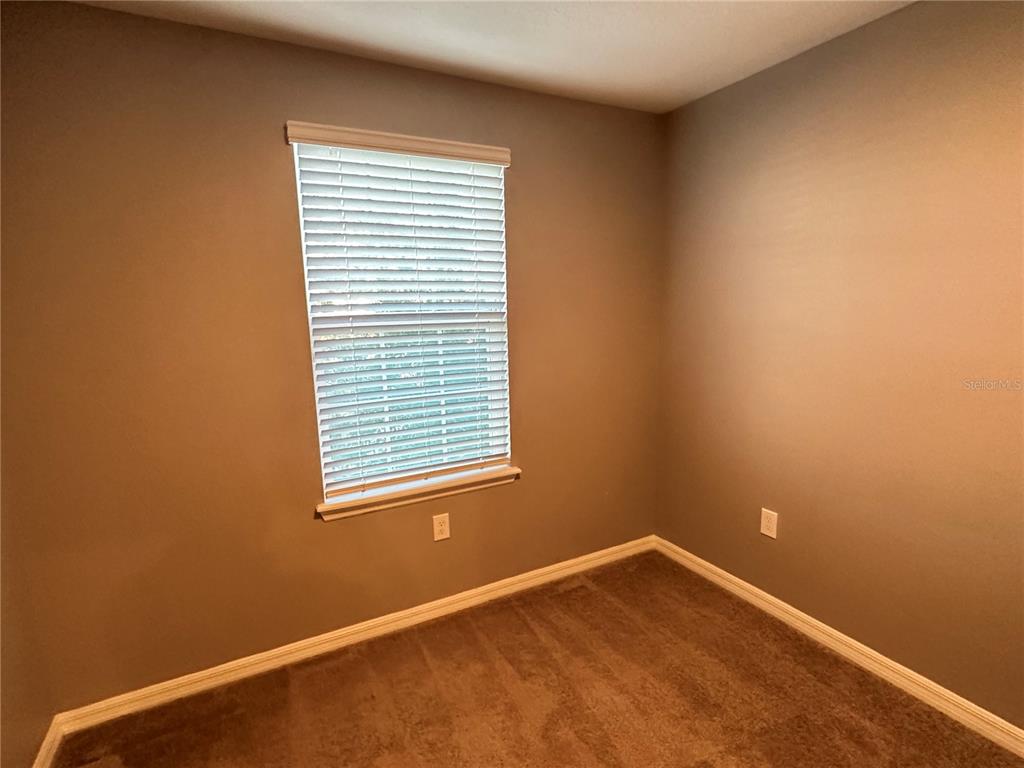 10834 Wyne Tree Orlando, FL 32824 - Photo 16 of 33 a view of an empty room with a window