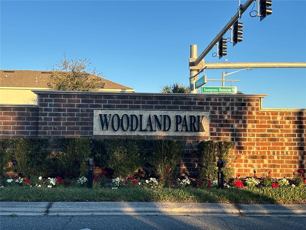 10834 Wyne Tree Orlando, FL 32824 - Photo 2 of 33 a front view of a building with garden