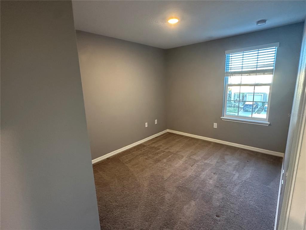 10834 Wyne Tree Orlando, FL 32824 - Photo 22 of 33 an empty room with a window