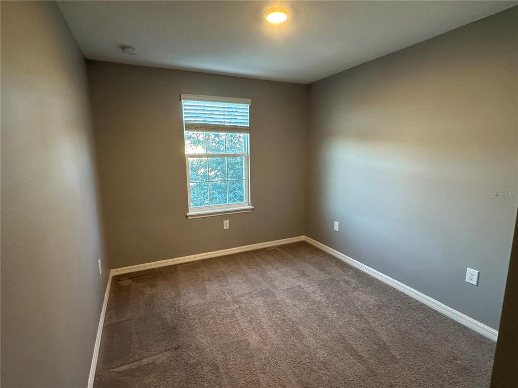 10834 Wyne Tree Orlando, FL 32824 - Photo 24 of 33 an empty room with a window