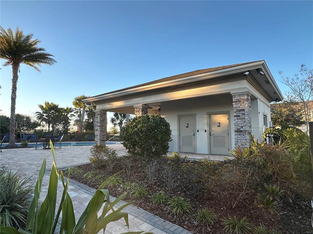 10834 Wyne Tree Orlando, FL 32824 - Photo 27 of 33 a front view of house with yard and trees around
