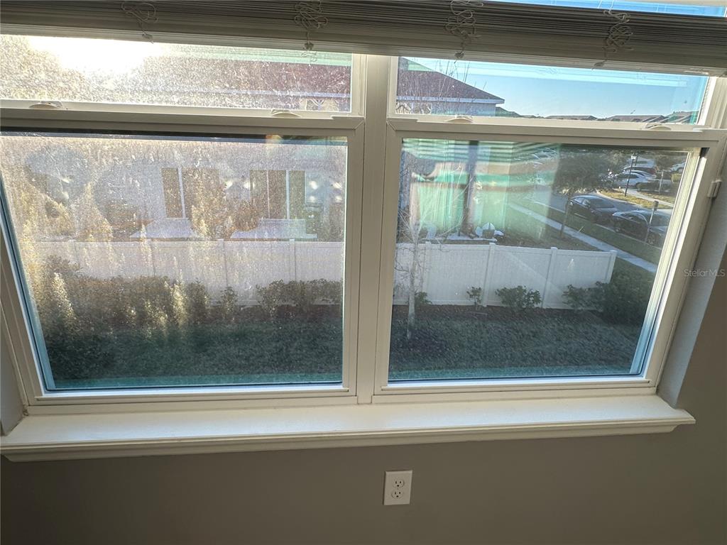 10834 Wyne Tree Orlando, FL 32824 - Photo 32 of 33 a bathroom with a glass door and a window