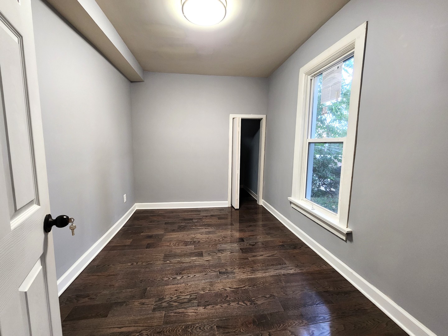 62 Seneca Street Elgin, IL 60120 - Photo 12 of 20 a view of an empty room and window