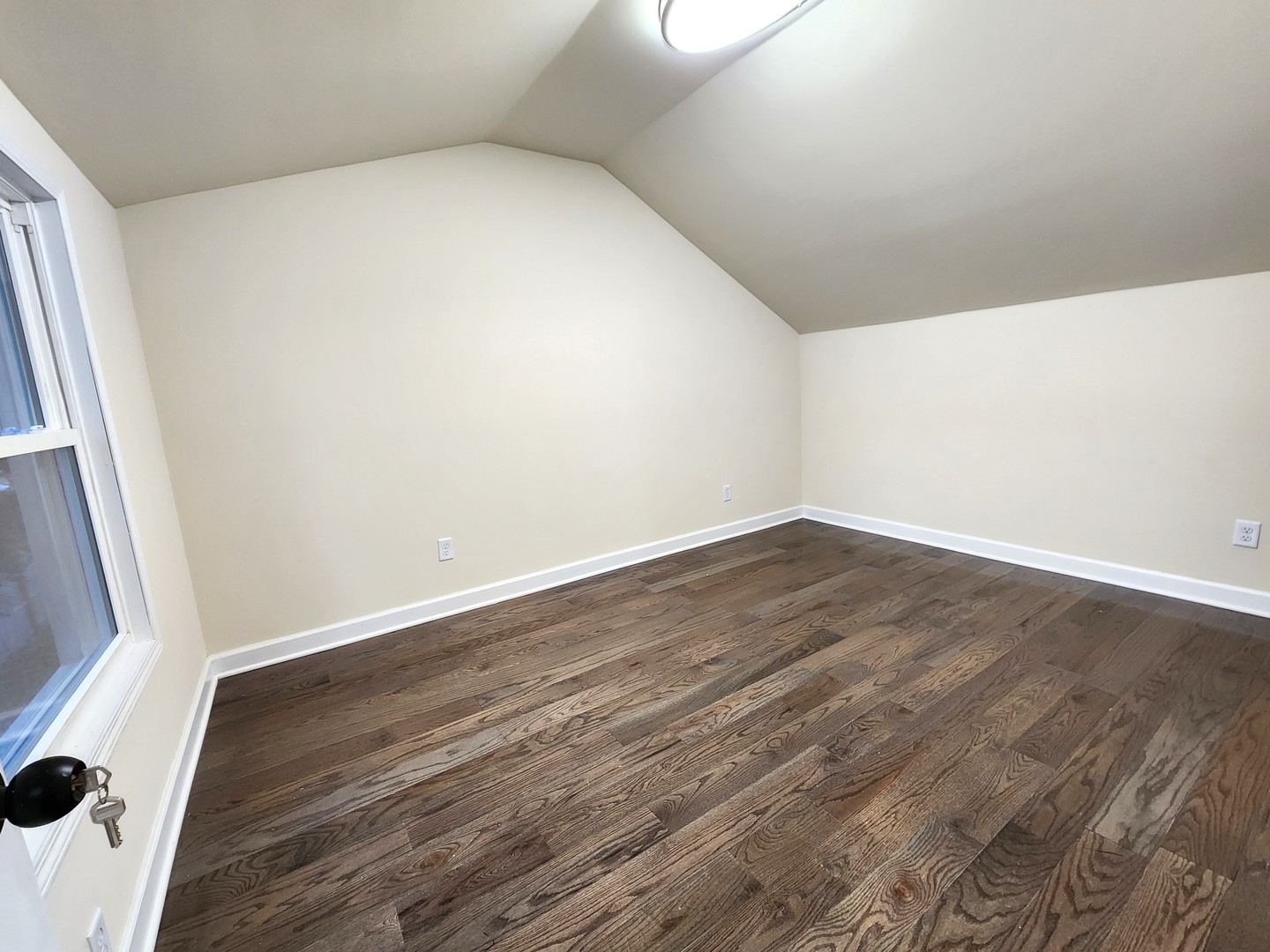 62 Seneca Street Elgin, IL 60120 - Photo 18 of 20 an empty room with wooden floor and door