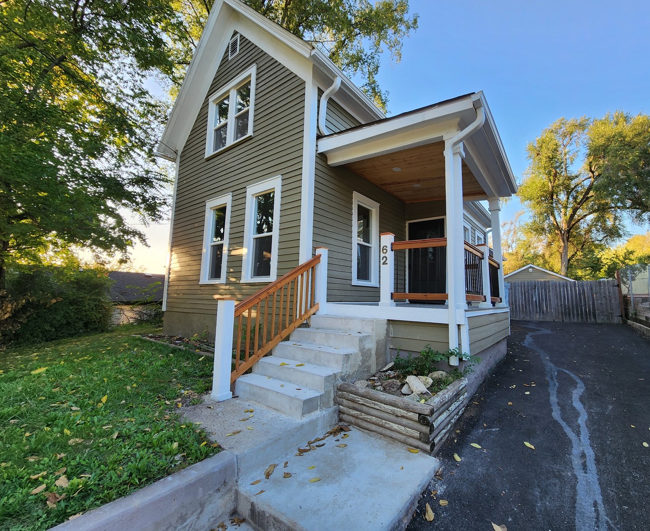 62 Seneca Street Elgin, IL 60120 - Photo 20 of 20 a front view of a house with garden
