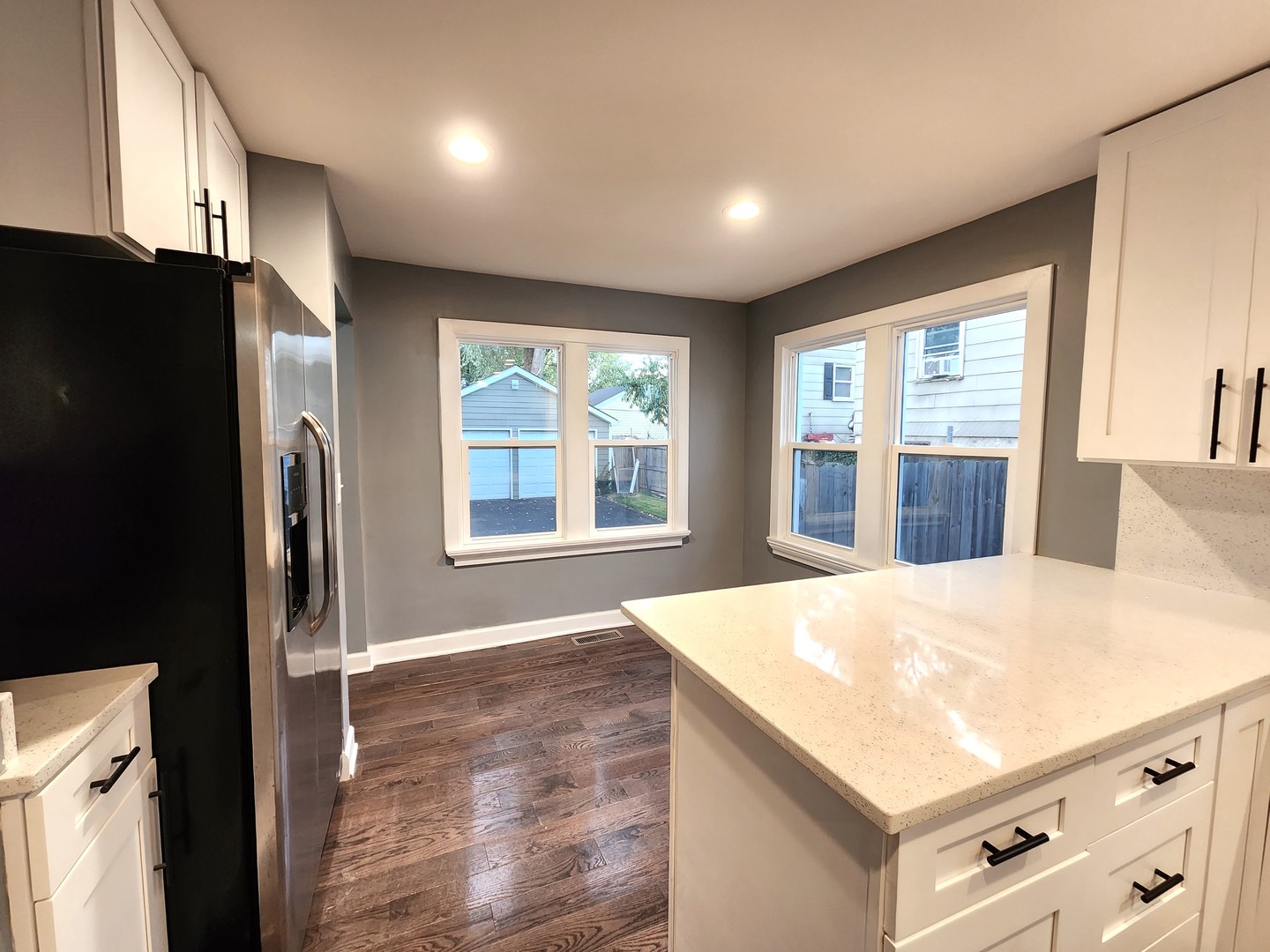62 Seneca Street Elgin, IL 60120 - Photo 5 of 20 a kitchen with stainless steel appliances a refrigerator and a stove