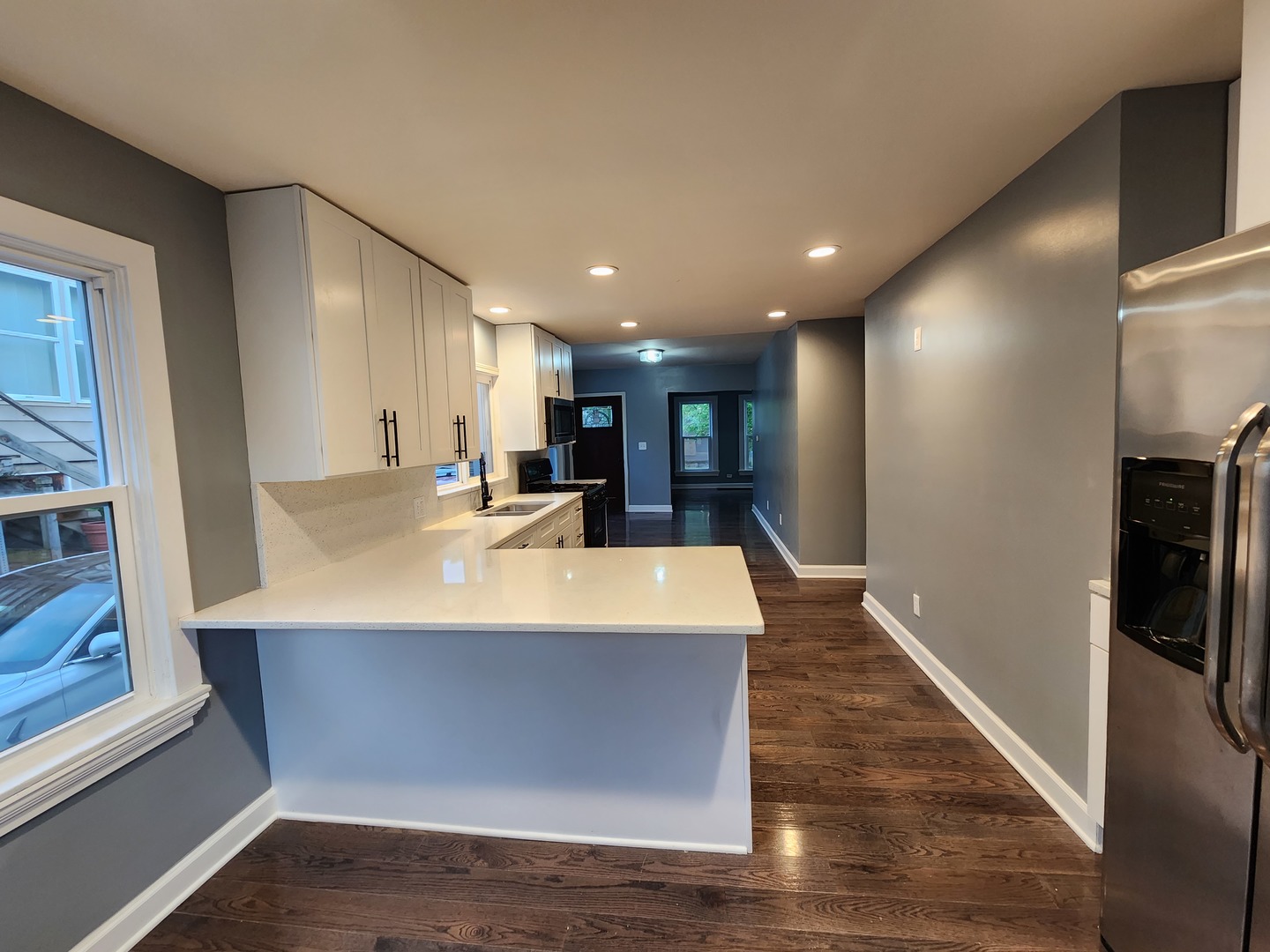 62 Seneca Street Elgin, IL 60120 - Photo 8 of 20 a view of kitchen with stainless steel appliances refrigerator sink and stove