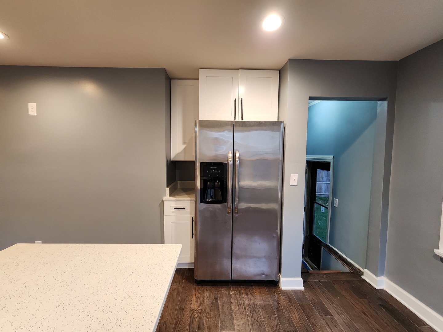 62 Seneca Street Elgin, IL 60120 - Photo 9 of 20 a kitchen with a refrigerator and wooden floor