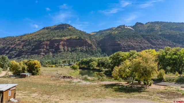 a view of a houses with a yard
