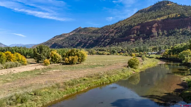 a view of a town with mountains in the background