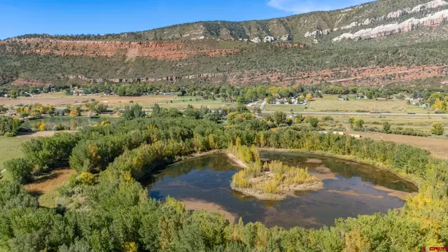 a view of a water with a mountain in the background