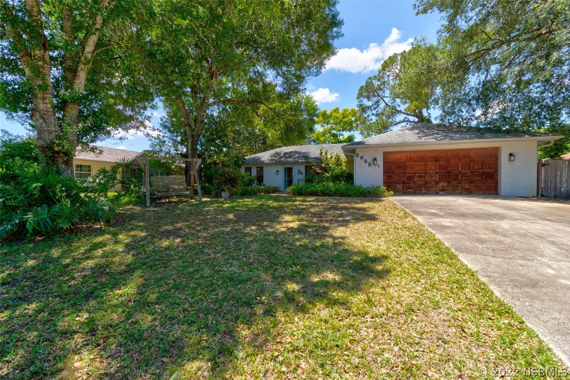 2628 Queen Palm Drive Edgewater, FL 32141 - Photo 2 of 15 a view of a house with a yard