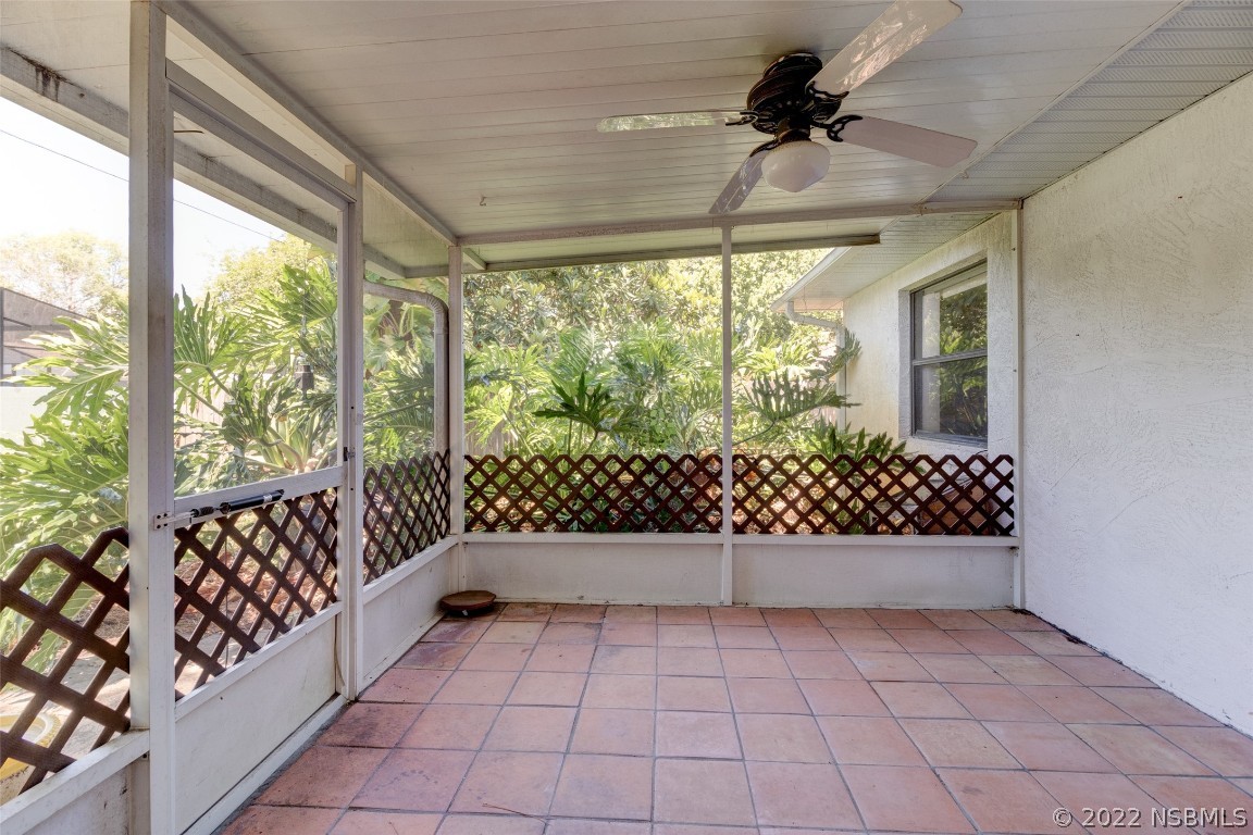 2628 Queen Palm Drive Edgewater, FL 32141 - Photo 8 of 15 a view of empty room with wooden floor and fan